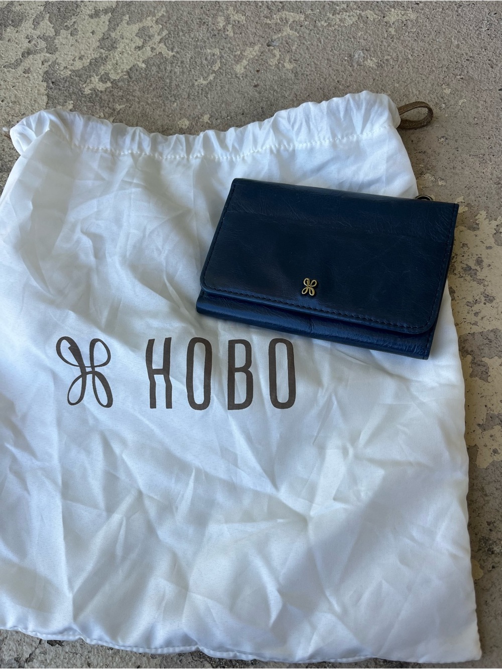 Like new HOBO Navy Blue Leather Fold Wallet with Gold Logo